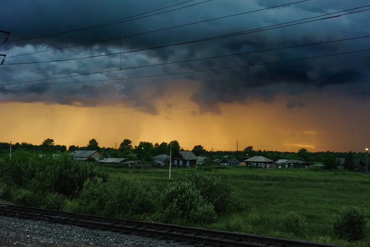 storm sky over the village in summer